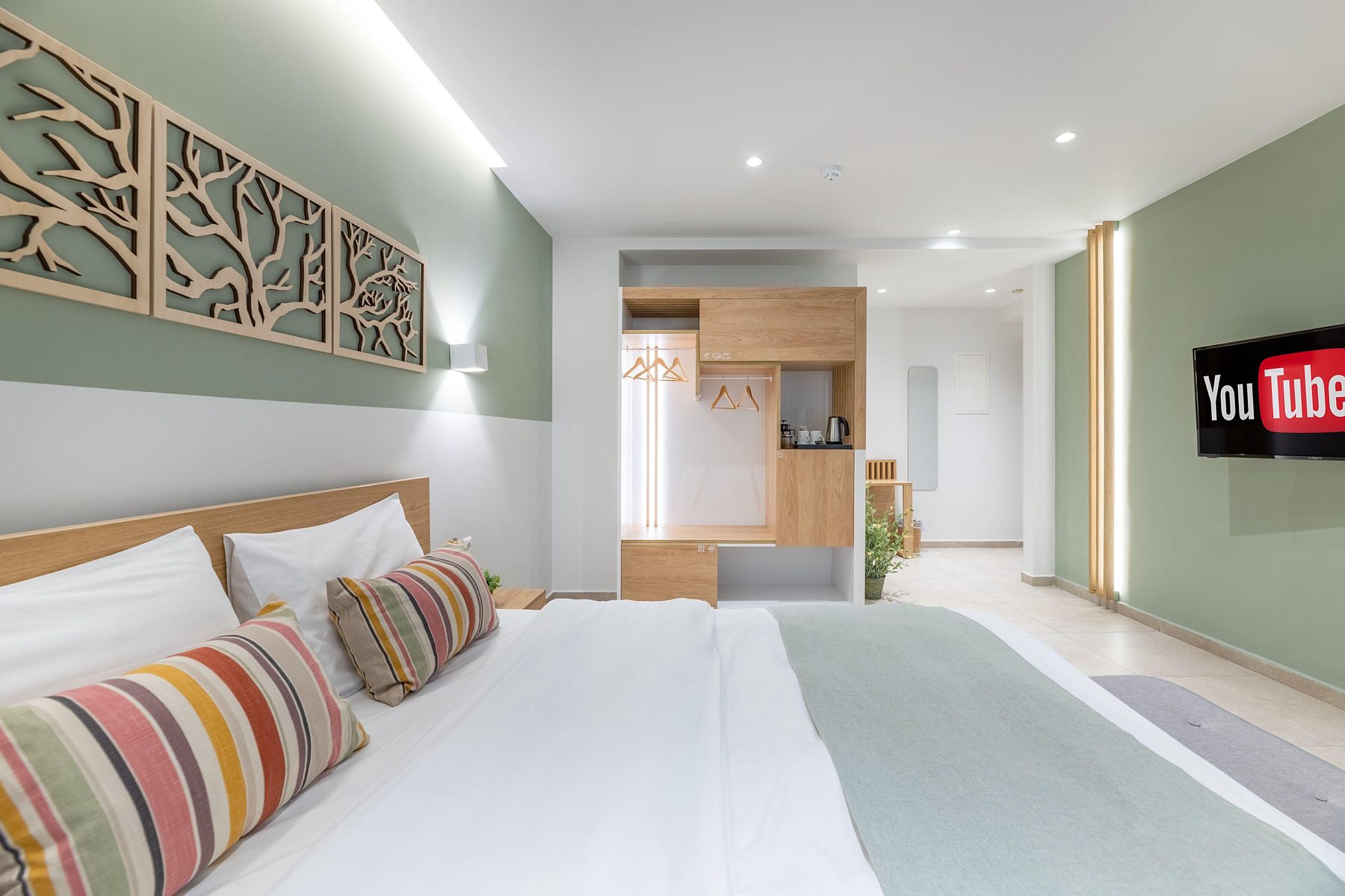Studio One, the row of branch panels above the bed