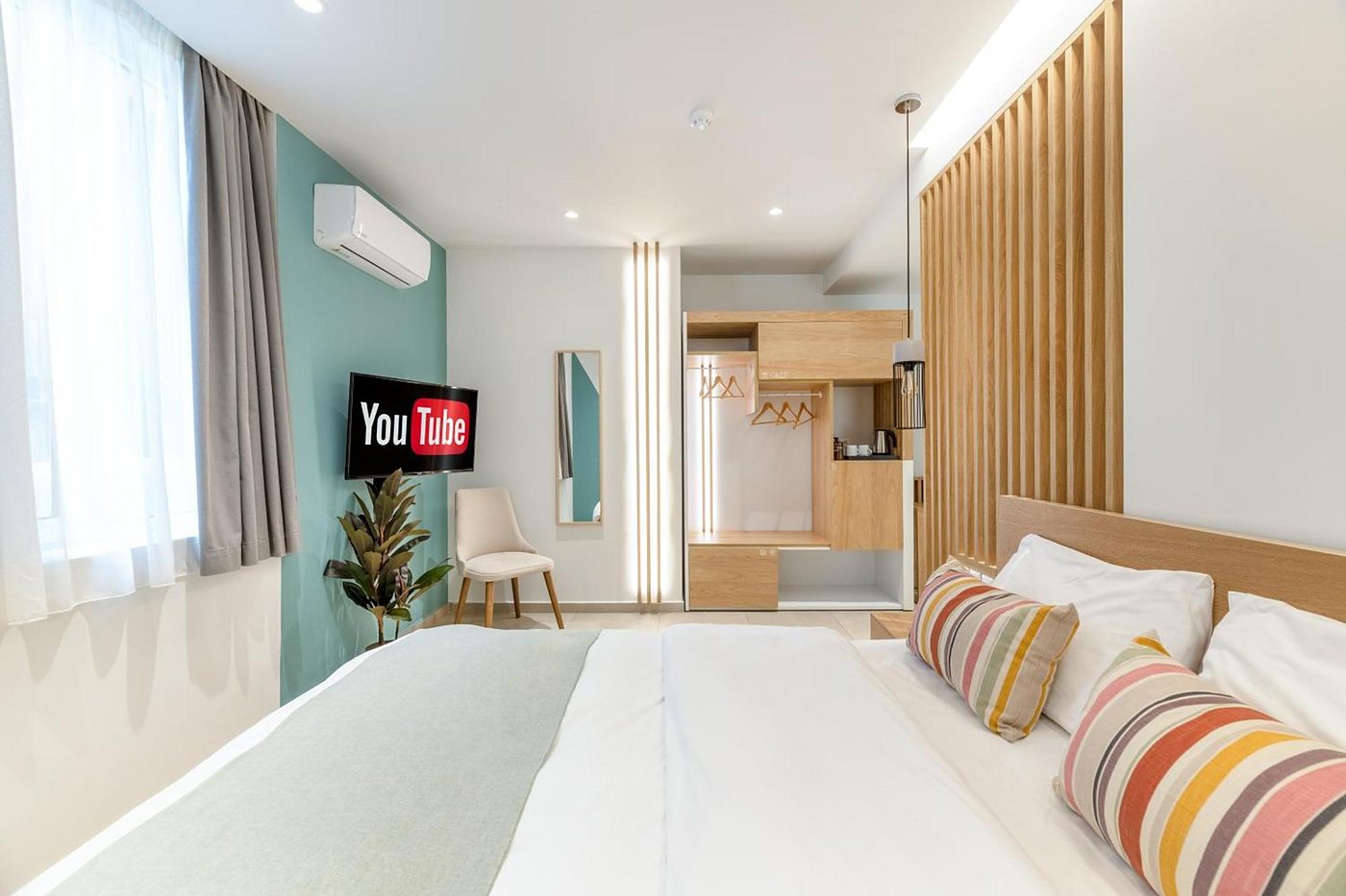 Studio Four, The slats screen the bed from the door.