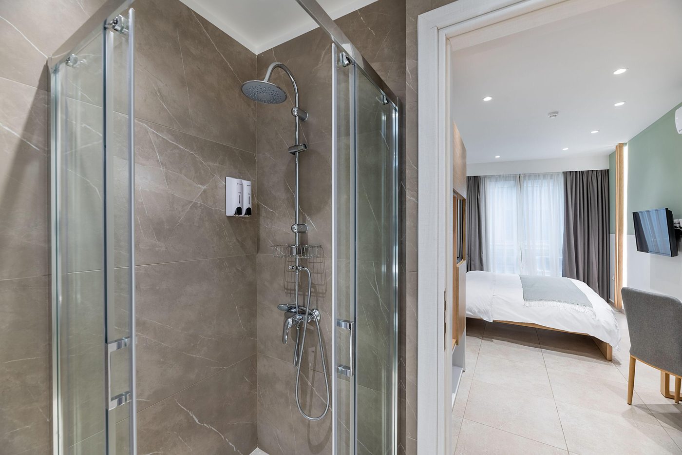 Studio Four, The shower, one glass wall from the room.