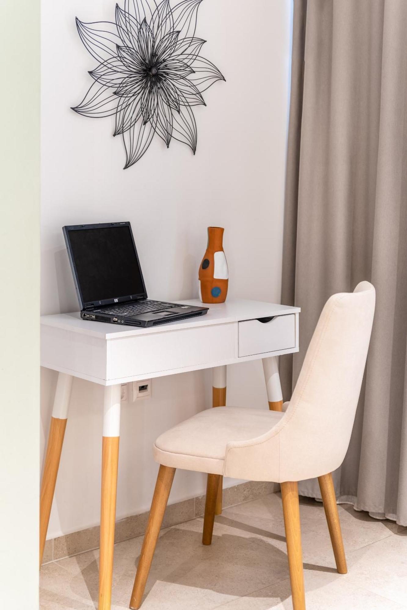 Studio Five, white vanity and wire flower art